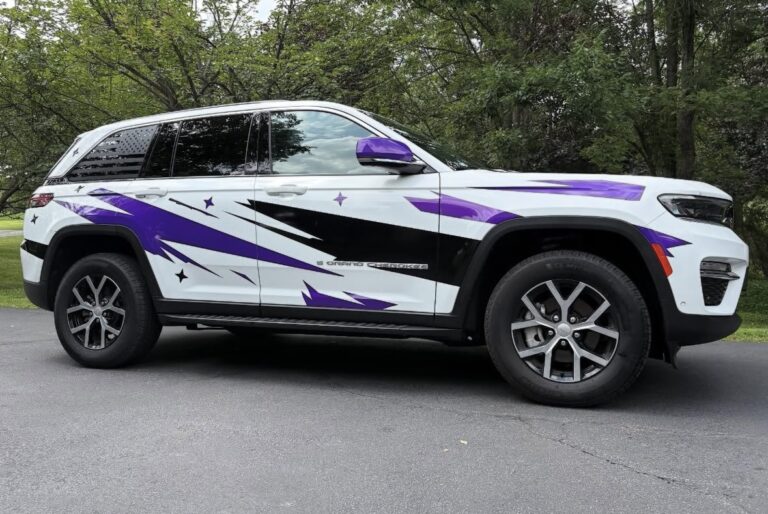 SUV partial wrap graphics in purple and black by Lombardo Lettering, New Jersey